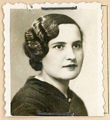 B&W portrait photo of a young woman with short wavy hair.