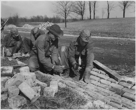 Civilian Conservation Corps workers on a project alongside a road