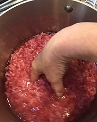 Crumbling ground beef in water.jpg