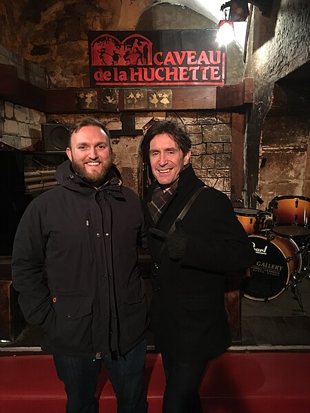 File:Director and Producer, Christian Francis-Davies and Presenter, Paul McGann in Le Caveau de la Huchette on the Left bank in Paris, the inspiration for the Cavern.jpg