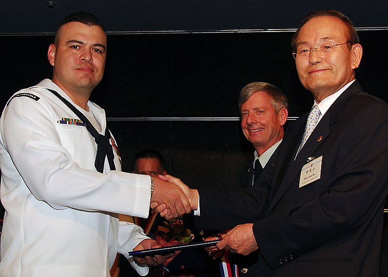 File:Equipment Operator 1st Class Mario Gonzalez, of Los Angeles, recieves an award from Mr. Chul-soo Han, President of the Korea-America Friendship Society.jpg