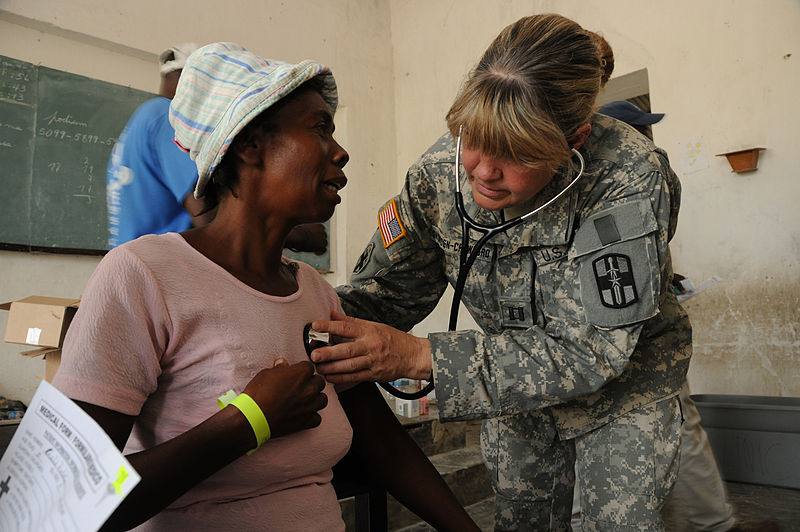 File:Examining the heartrate - help relief in Haiti.jpg