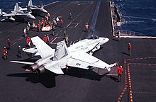 A Marine F/A-18 from VMFA-451 preparing to launch from USS Coral Sea (CV-43) F-18A Hornet VMFA-451 USS Coral Sea 1989.jpeg