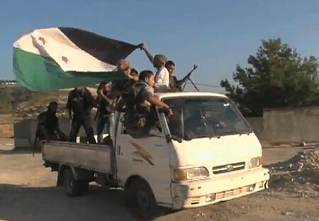 FSA soldiers in truck moving.jpg