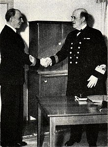 The newly-appointed chief, vice admiral Helge Stromback (left) shakes hand with the departing vice admiral Fabian Tamm, 1 April 1945. Fabian Tamm and Helge Stromback, 1 April 1945.jpg