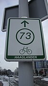 Signpost giving directions to junction 73 in Bicycle junction network Haaglanden