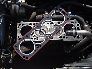 <span class="mw-page-title-main">Head gasket</span> Gasket that sits between the engine block and cylinder head(s) in an internal combustion engine