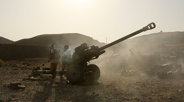 ISAF soldiers with 7th Parachute Regiment Royal Horse Artillery fire their 105mm Light Gun at Taliban positions. Kajaki, Afghanistan, 28 August 2008