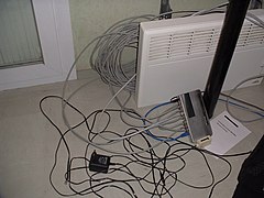 Installing an unauthorized LAN in student rooms in 2003, by drilling holes behind heaters. Residence ARPEJ Technopole Plouzane 2.jpg