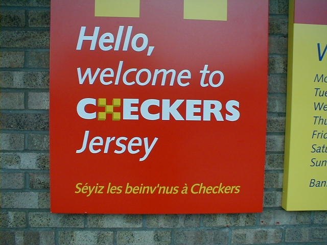 Some bilingual (or trilingual) signage may be seen in Jersey, such as this welcome sign at a supermarket