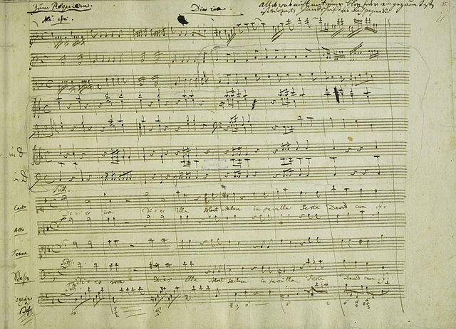 The beginning of the Dies irae in the autograph manuscript, with Eybler's orchestration. In the upper right, Nissen has left a note: "All which is not