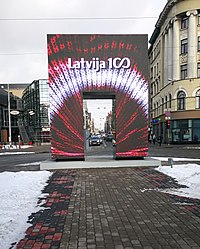 Event logo on a digital screen in Riga on Brivibas iela Latvijai 100 ekrans.jpg