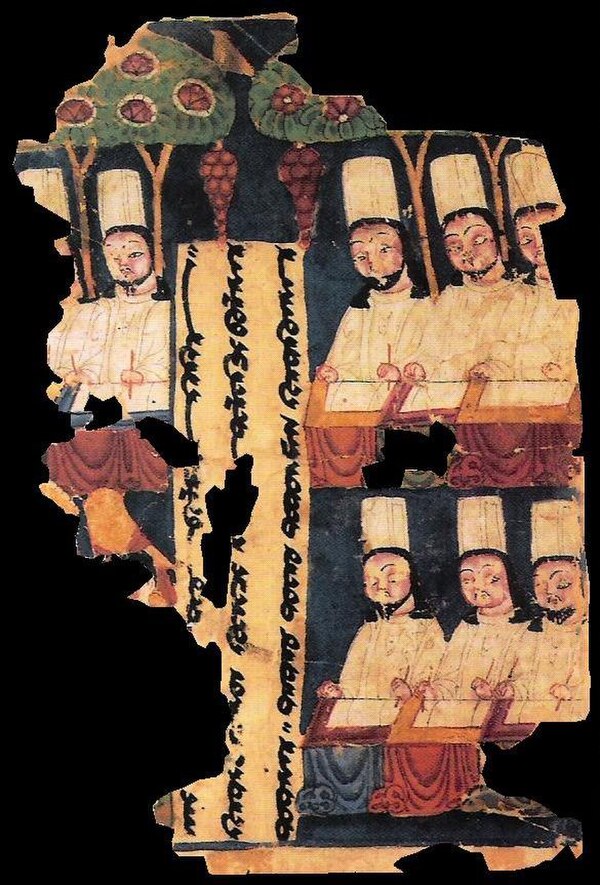 Manichaean priests, writing at their desks. Eighth or ninth century manuscript from Gaochang, Tarim Basin, China.
