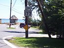 Eastern terminus of MD 177 with the gatehouse at the entrance to Gibson Island in the background