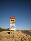 A multilingual road sign in German, Italian, Japanese and Pitjantjatjara. Quite an unusual sight for Australia.