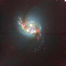 Near infrared image of the central region of NGC 5135 by Hubble Space Telescope. NGC 5135 Color cutout HST 10169 14 NIC NIC2 F190N F160W F110W sci.jpg