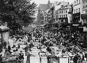 Les Halles street market in 1920 Nearly identical views of street market in Paris, France.jpg