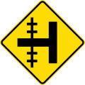 (W15-1.1/PW-13.1) Railway level crossing on side road to left