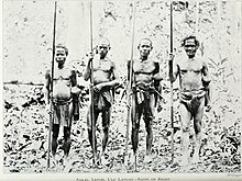 A band of Senoi hunters with blowgun from Lepoh, Hulu Langat District, Selangor, 1906. The batin, village head is on the right. Pagan races of the Malay Peninsula (1906) (14781618475).jpg