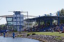 Regatta course with judges tower, residence and changing building, restaurant, kiosk, ticket booth, sculpture of a rower