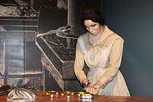 Exhibit of a woman canning sardines at the Maine State Museum in Augusta; sardines are a component of the economy of Maine. Sardine canner, Maine State Museum at Augusta IMG 1987.JPG