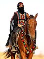 Image 3A Saudi woman riding a horse at Souk Okaz, a yearly cultural festival in the outskirts of Taif (from Culture of Saudi Arabia)