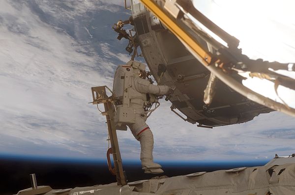 Scott Parazynski during a spacewalk during STS-120.