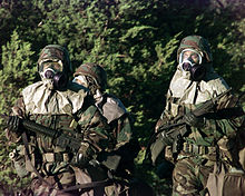 U.S. soldiers wearing full chemical protection. Soldiers at MOPP level 4.jpg