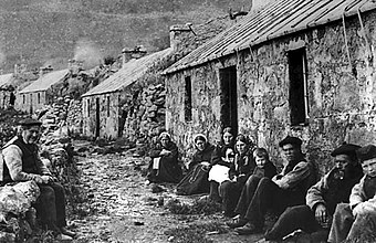 St. Kildans sitting on the village street Victorian-era Property of the National Trust for Scotland taken in 1886.