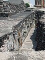 Serpent heads on wall on eastern side