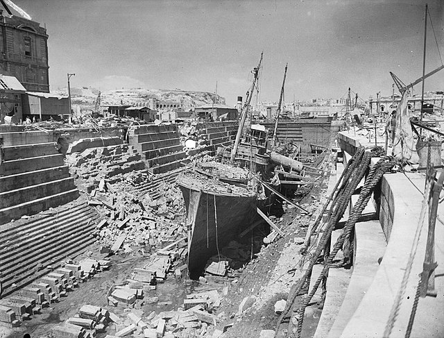 The armed trawler HMS Coral within a bomb-damaged Dry Dock No 3 during World War II