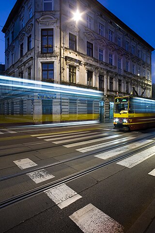 Konstal 105N-series tram in Przybyszewskiego street, Łódź. The tram stopped, then went.