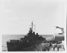 The destroyer USS Charles Ausburne (DD-570) alongside Columbia in September 1943 USN 80-G-201993 Charles Ausburne (DD-570) receiving mail by highline from Columbia while steaming in the Solomon Islands, 27 September 1943.png