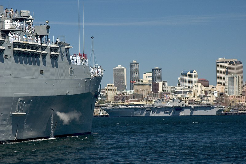 File:US Navy 050803-N-3390M-002 The amphibious transport dock USS Ogden (LPD 5), left, and the amphibious assault ship USS Bonhomme Richard (LHD 6) pass downtown Seattle while taking part in the parade of ships during the 55th annua.jpg