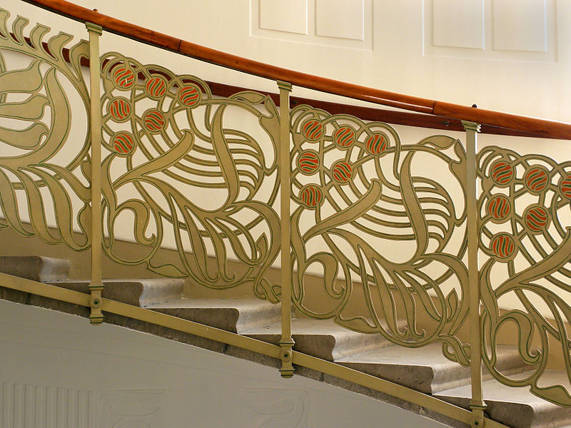 Highly stylized floral designs in balconies and railings. Otto Wagner stairway in Majolica House, Vienna (1898)