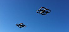 AR.Drone 2.0 in flight with indoor hull 2 Parrot AR.Drone 2.0 in flight.jpg