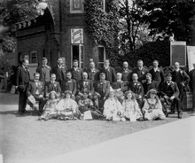 A formally posed group of men and girls at the main entrance, in 1909 A group portrait at Rosherville Gardens, Northfleet RMG G02346.tiff