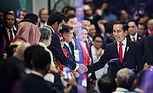 Indonesian President Joko Widodo shakes hand with Joann Al Thani, the Qatar Olympic Committee president. Asian Games 2018 opening by Tasnim 15 (cropped).jpg