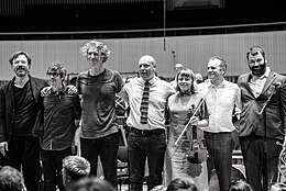 Bell Orchestre after a concert with Aarhus Symphony Orchestra in Aarhus (Denmark 2019.)
Conductor Andre de Ridder far left. Bell-Orchestre Andre de Ridder DSC06018.jpg