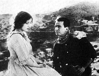 Bessie Love and Douglas Fairbanks as Amy and Passin' Through Bessie Love and Douglas Fairbanks in The Good Bad-Man (1916).jpg