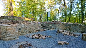 restored foundation walls of the castle;  Foreground: unfinished hall;  Background: remains of a residential tower