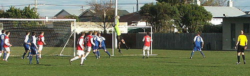 The Mosgiel goalkeeper (Andy James) stops a Caversham cross from reaching its target, Tonga Park, Dunedin, 31 July 2010. Mosgiel are playing in the blue strip. Cavvy-vs-Mosgiel.jpg