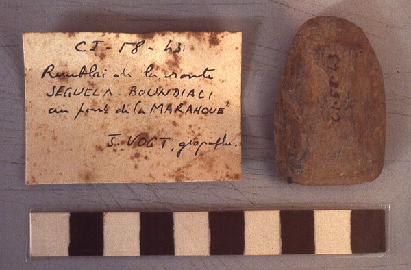 Prehistoric polished stone celt from Boundiali in northern Ivory Coast, photo taken at the IFAN Museum of African Arts in Dakar, Senegal