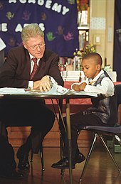 Clinton reading with a child in Chicago, September 1998. ClintonChild.jpg
