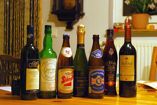 A selection of alcoholic drinks (from left to right): red wine, malt whisky, lager, sparkling wine, lager, cherry liqueur and red wine