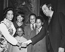 Coretta Scott King, NEC alumna and widow of Dr. Martin Luther King Jr., accompanied by her children, shakes hands with NEC President Gunther Schuller in Jordan Hall, May 1971 Coretta Scott King and family with NEC President Gunther Schuller.jpg