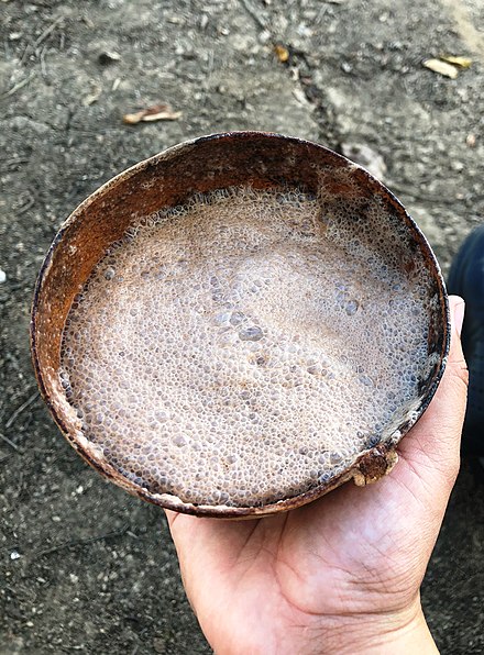 Popo served in a traditional container, a jícara (wooden bowl)