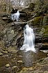 Waterfall over brown rocks