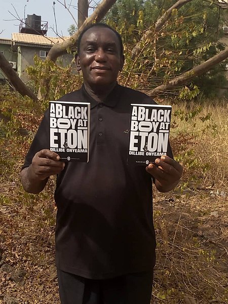 File:Dillibe Onyeama holding copies of his book ‘A BLACK BOY AT ETON’ which was reissued by penguin in 2022.jpg
