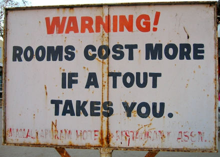 Warning! Rooms cost more if a tout takes you.